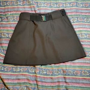 Black back zip above the knee skirt.